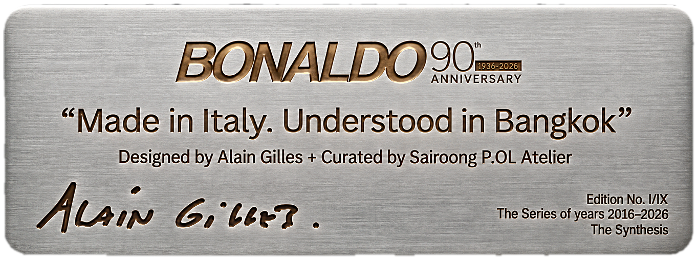 Solid brass plaque for Chair No. I: 'Made in Italy. Understood in Bangkok.' Designed by Alain Gilles + Curated by Sairoong P. OL Atelier. No. I of IX · Commissioned through OL Atelier, Bangkok · The Series of Years 2016–2026 · The Synthesis, bearing Alain Gilles' signature.